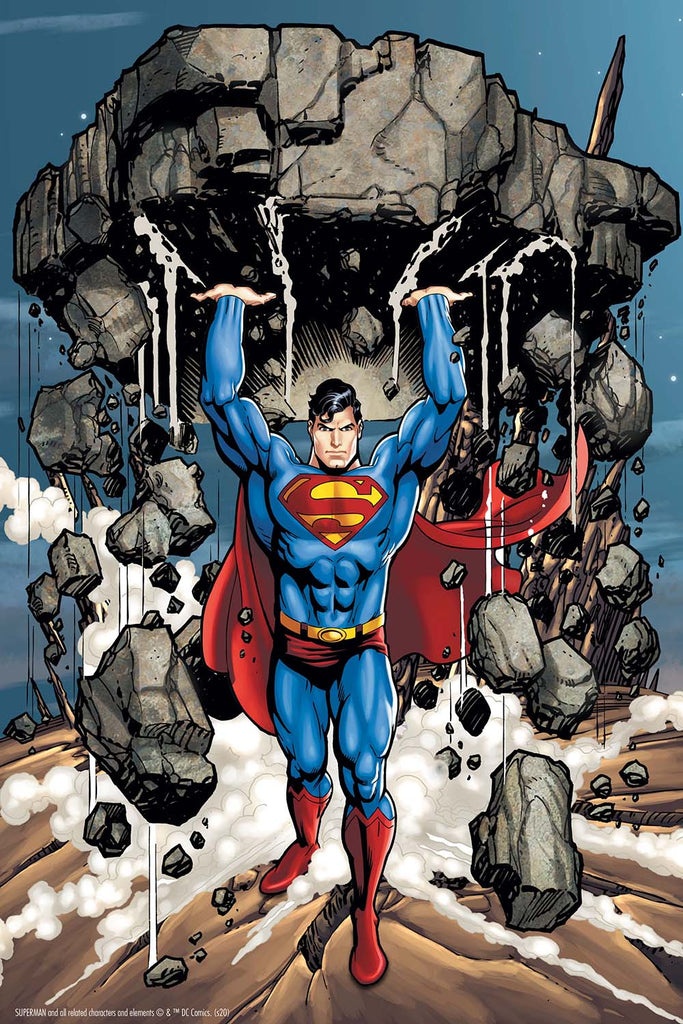 Amidst debris and dust, Superman, the iconic DC Comics superhero in a blue costume and red cape, lifts a massive rock above his head as if it's an oversized toy 