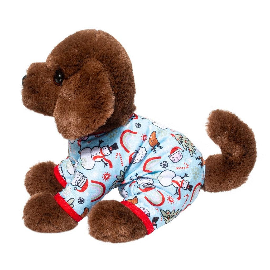 A brown plush puppy, reminiscent of a Chocolate Lab stuffed animal, is wearing blue pajamas with red trim and a snowman pattern, sitting upright. Perfect for holiday snuggles.