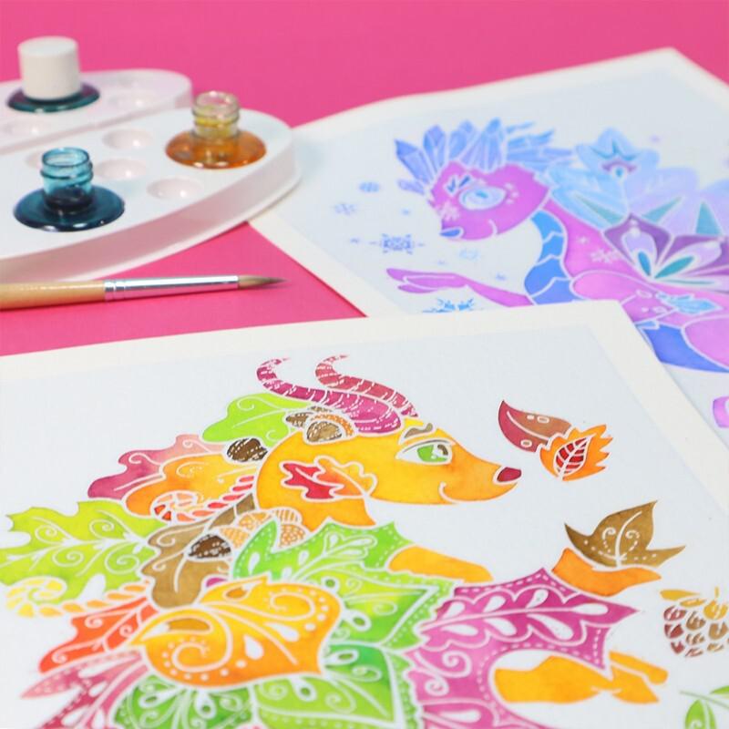 Colorful watercolor masterpieces of two mythical creatures, complete with a paint palette and brush, grace a pink background.