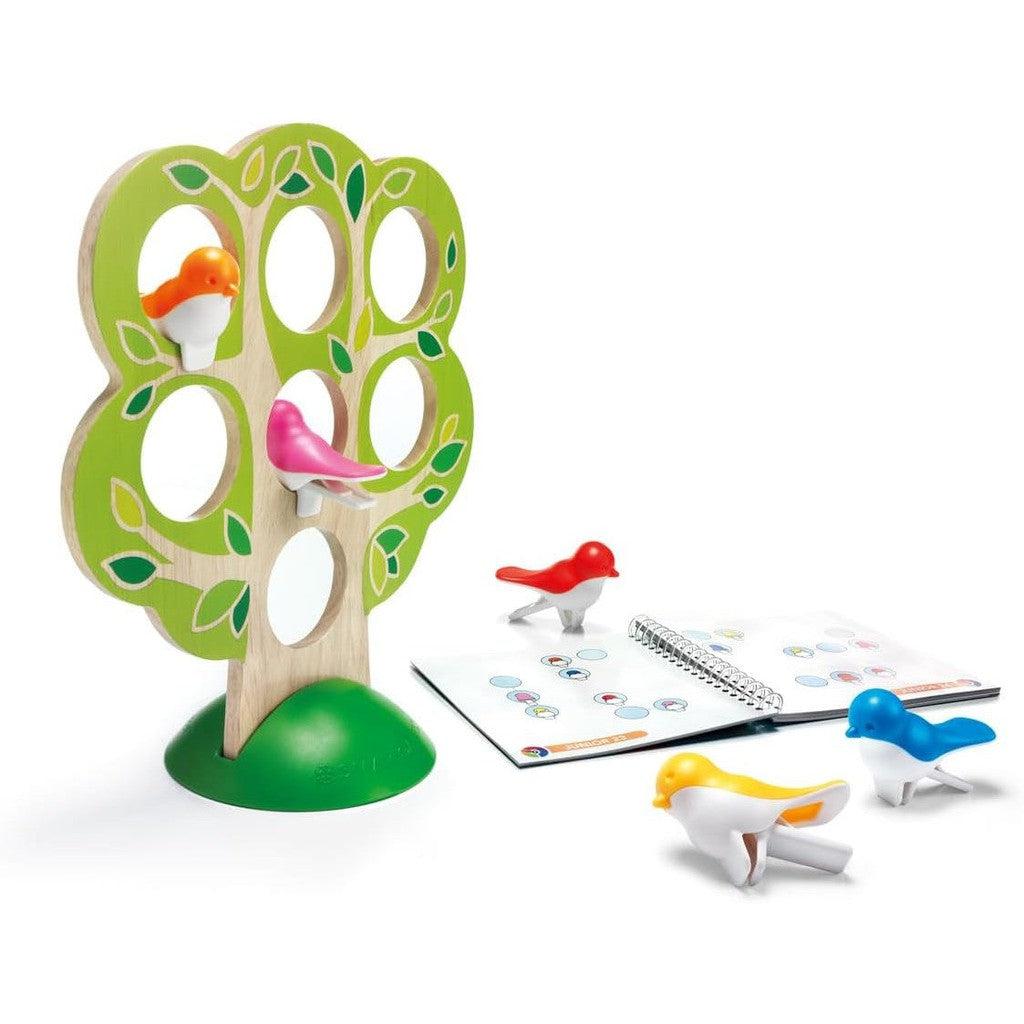 Puzzle game featuring a tree with colorful bird pieces. The box shows "5 Little Birds" and highlights it's a SmartGames single-player experience to develop deduction skills in stacking games.