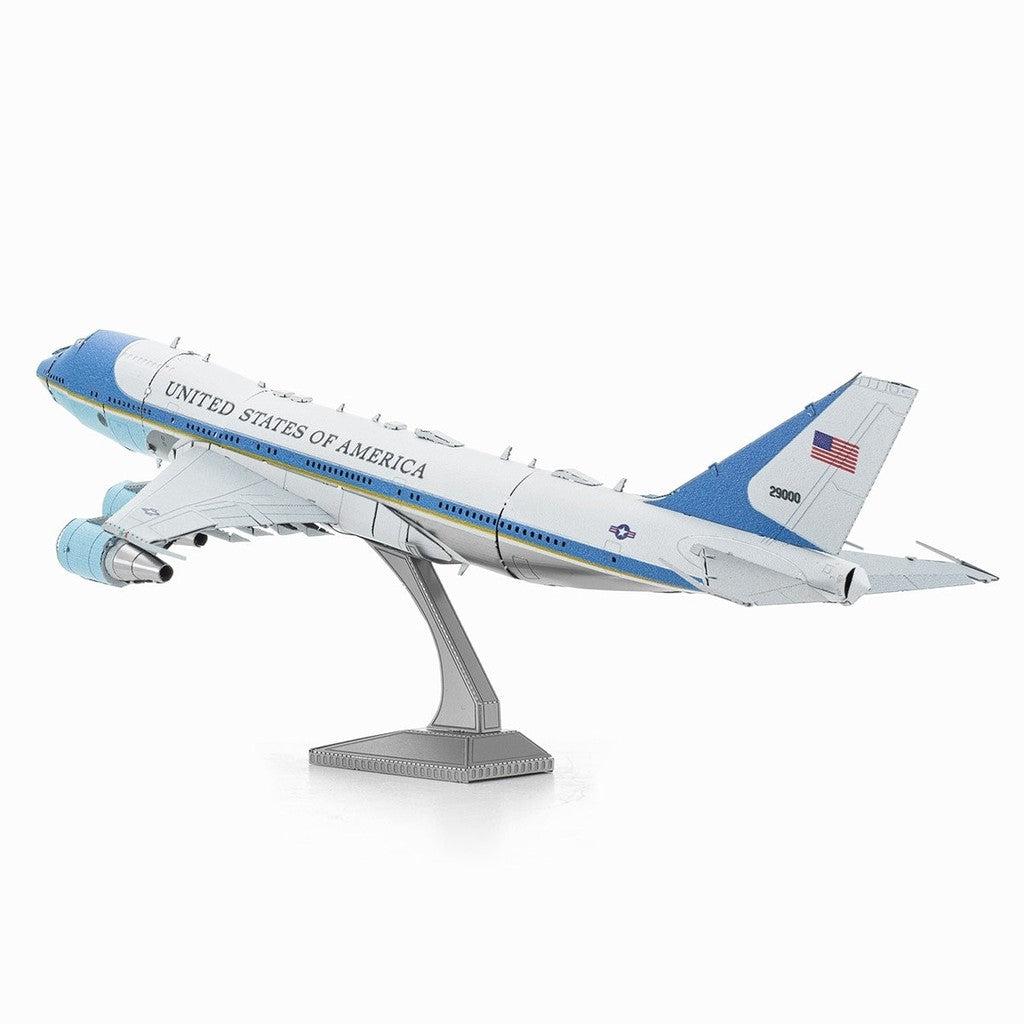 image shows a model silver and blue model airplane