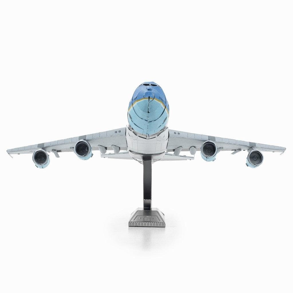 image shows a model silver and blue model airplane