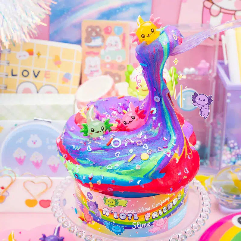 Rainbow colored slime being played with, filled with sprinkles and axolotl charms