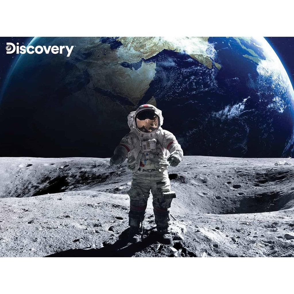 An astronaut stands on the moon's surface with Earth visible in the background, embodying a scene that's both captivating and educational. The Discovery logo graces the top left corner