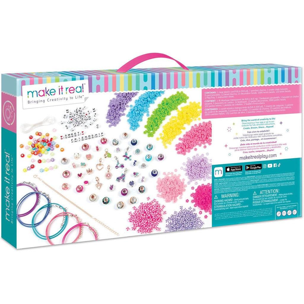 This DIY Craft Kit is a Jewelry Studio in a box, complete with colorful beads, charms, clear strings, and detailed instructions for creating stunning bracelets. The packaging boasts a vibrant rainbow stripe design and includes essential safety warnings. Website and company info included.