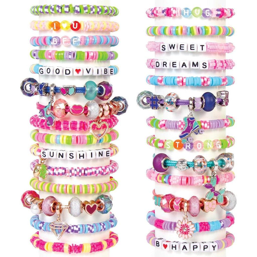 This colorful stack of bracelets, crafted from a Deluxe Jewelry Studio, features vibrant beads and charming accents. Some spell out words like "LOVE," "BFF," and "SUNSHINE," perfect for expressing yourself through DIY creativity.