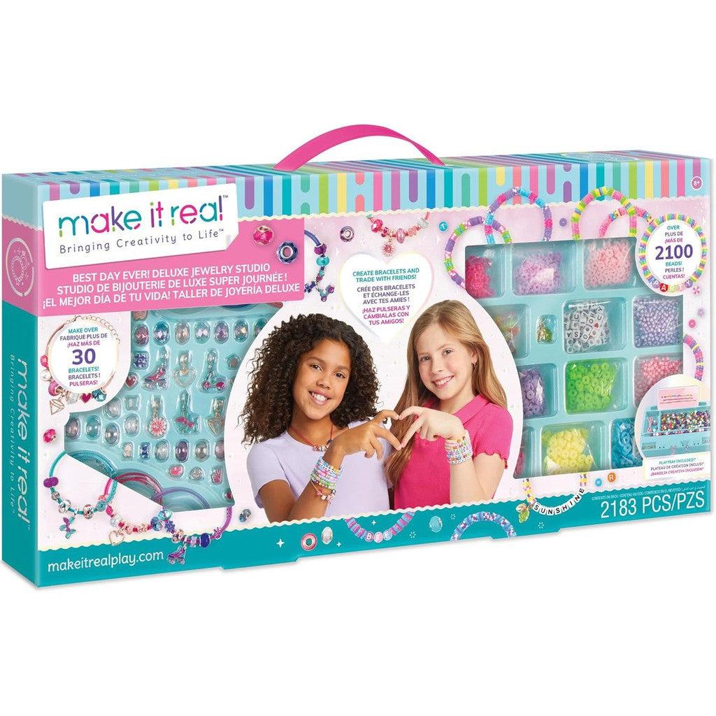 A DIY craft kit with beads, tools, and instructions showcases two children proudly displaying their creations. The jewelry studio box boasts 2183 pieces, allowing for the crafting of over 30 unique bracelets.