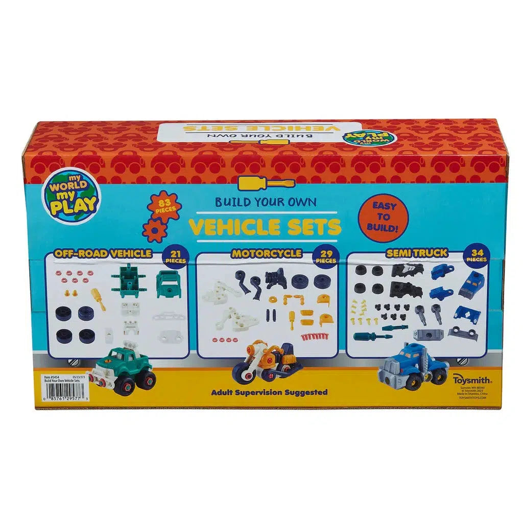 Toy vehicle sets box featuring an off-road truck, motorcycle, and semi-truck cab with piece counts of 21, 29, and 34 respectively. Text says "Build Your Own Vehicle Sets" and "Adult Supervision Suggested.