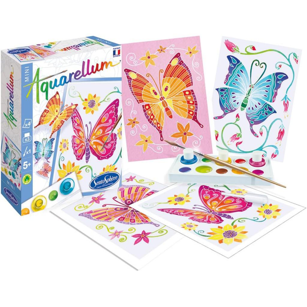 The Aquarellum Butterflies painting kit showcases vibrant butterfly designs with Sento Sphere's signature style. It includes paintbrushes, a watercolor paint set, a palette with paints, and completed artwork. The box also features similar enchanting butterfly illustrations.