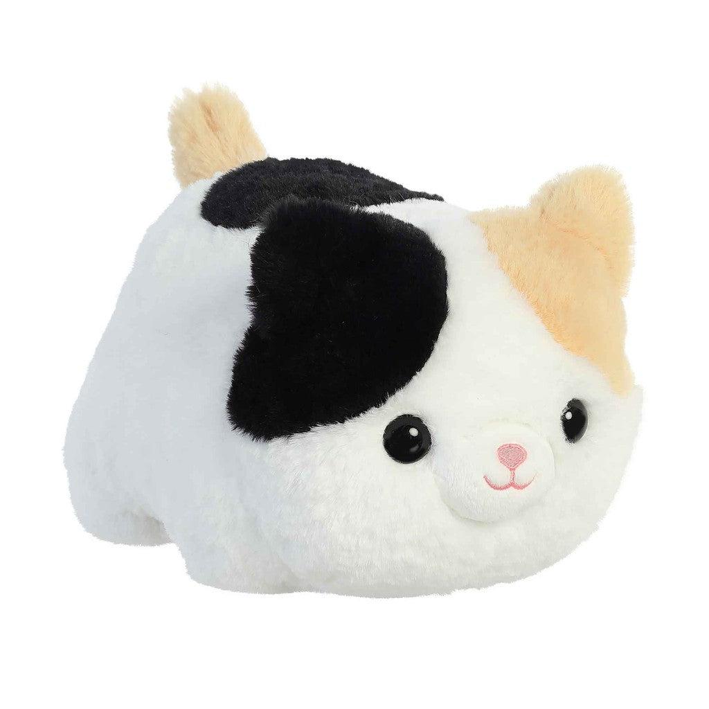 A plush toy from the Aurora collection shaped like a small, round cat with black, white, and orange patches, featuring large black eyes and a tiny pink nose. Part of the Spudsters family of plush friends!