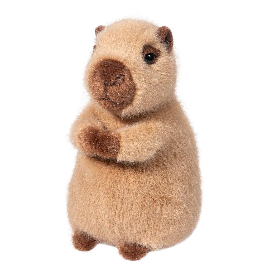 The Mini Soft Capybara is a delightful plush toy with soft brown fur and a round body, standing upright with its arms folded. This charming stuffed animal is perfect for capybara enthusiasts of all ages.