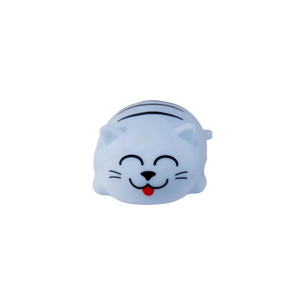 A small, Toysmith cat face with a smiling expression and its tongue sticking out, embodying the playful spirit of Chubby Kitties, set against a plain white background.