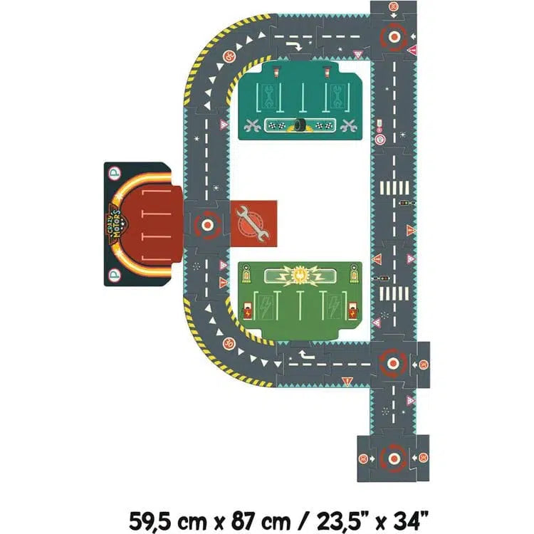 Aerial view of a toy racetrack layout featuring multiple circuits and Crazy Motors cars, complete with roads, intersections, and parking areas. The setup measures 59.5 cm by 87 cm (23.5" x 34").