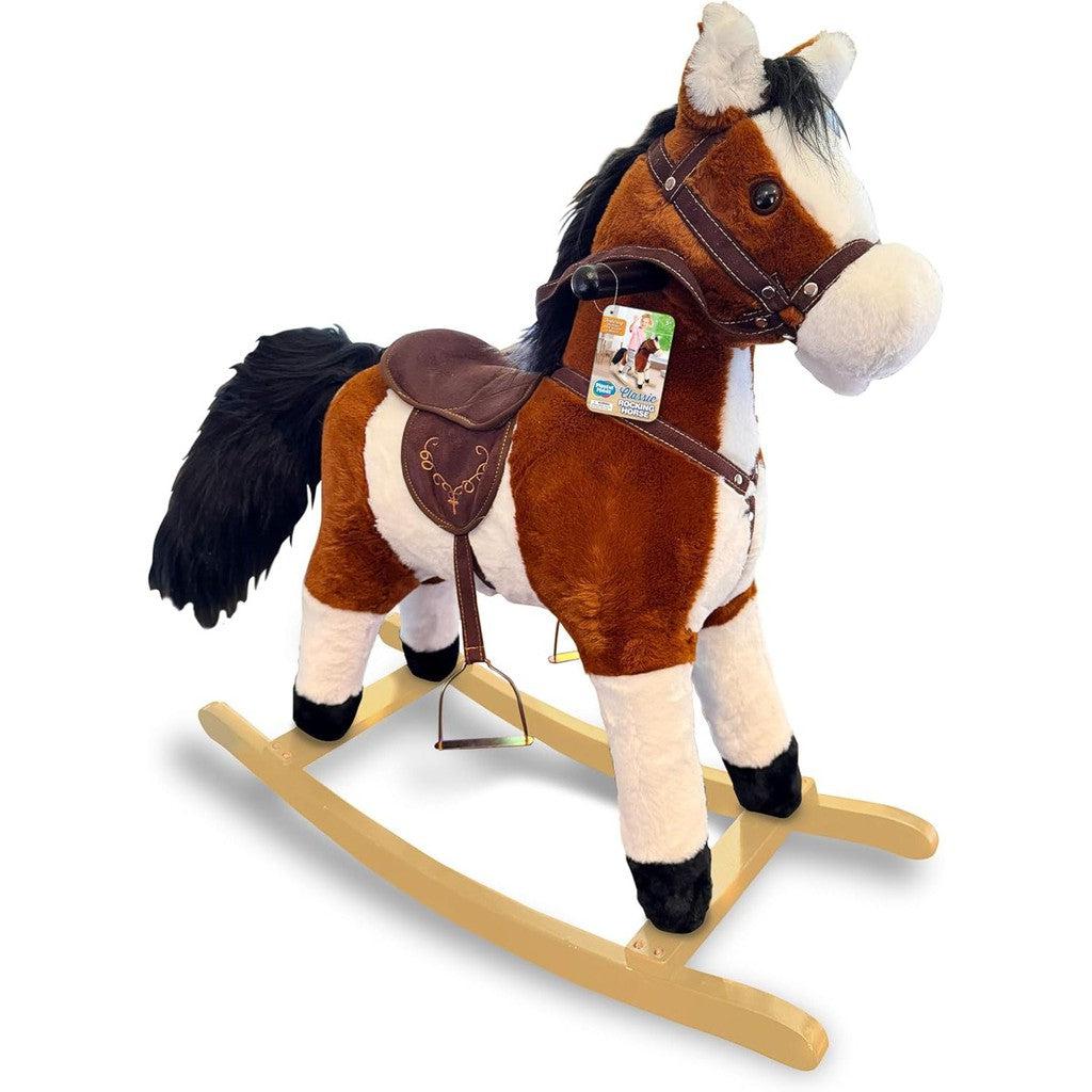 A brown and white plush rocking horse on a wooden rocker, featuring an animated tail and a saddle with bridle.