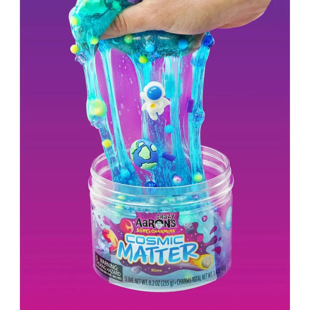 hand stretching slime that has charms in it