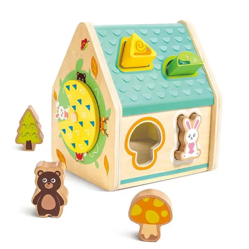 A delightful wooden toy house from Hape Toys features colorful shapes, including a yellow triangle, green oval, and circular dial. Accompanied by charming wooden figures—a tree, bear, rabbit, and mushroom—it invites endless imaginative play in any child's world.