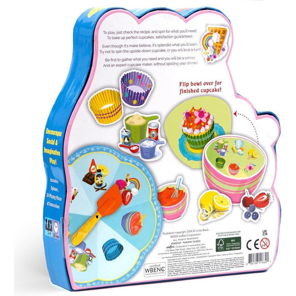 Back of a bakery-themed board game box showcasing vibrant images of cupcakes and a cupcake-shaped spinner. Perfect for preschool ages 3+, this delightful animal and baking-themed game includes a spinning wheel and components listed on the left side to ensure endless fun.