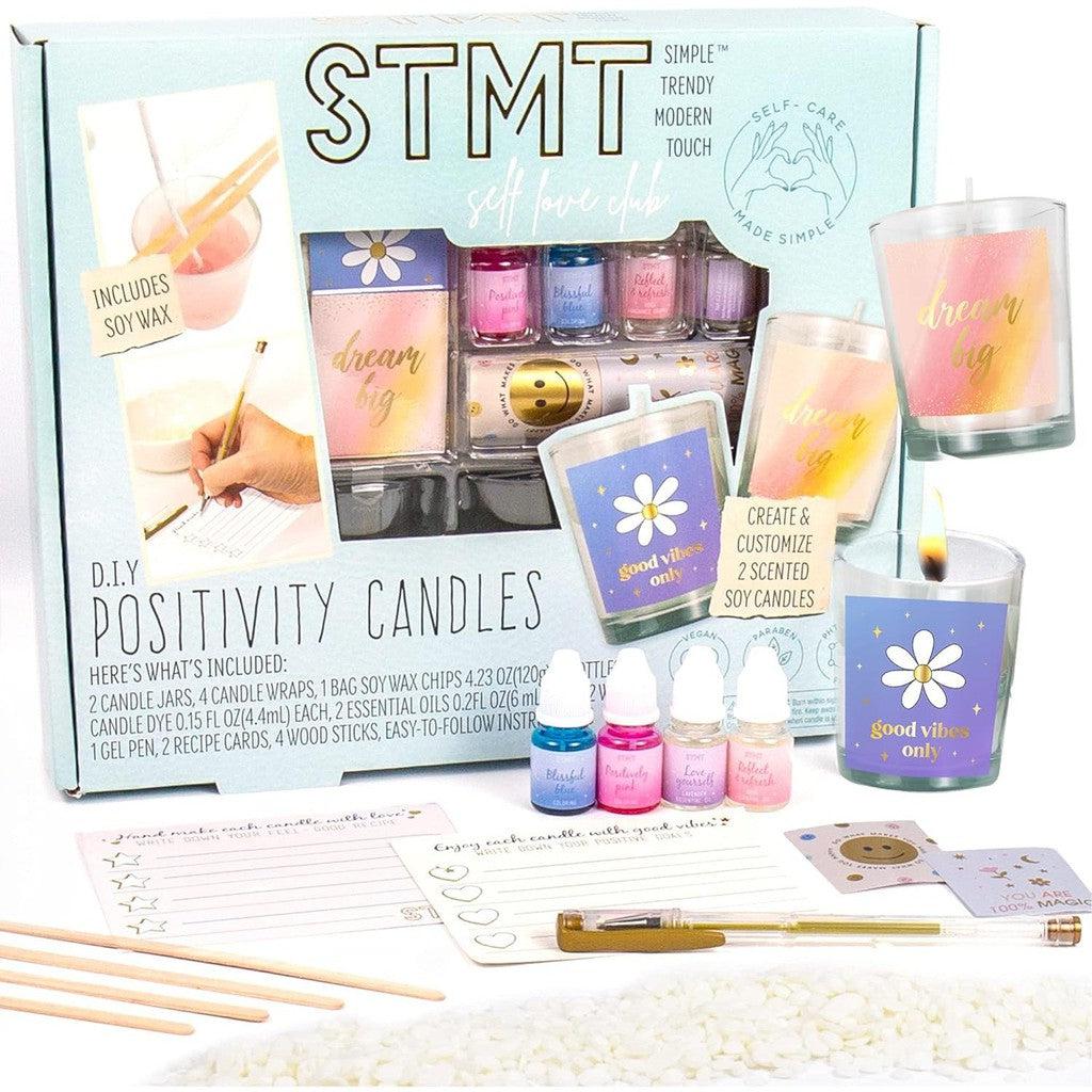 STMT DIY Positivity Candles come in a teal box with everything you need to create two scented soy candles. 