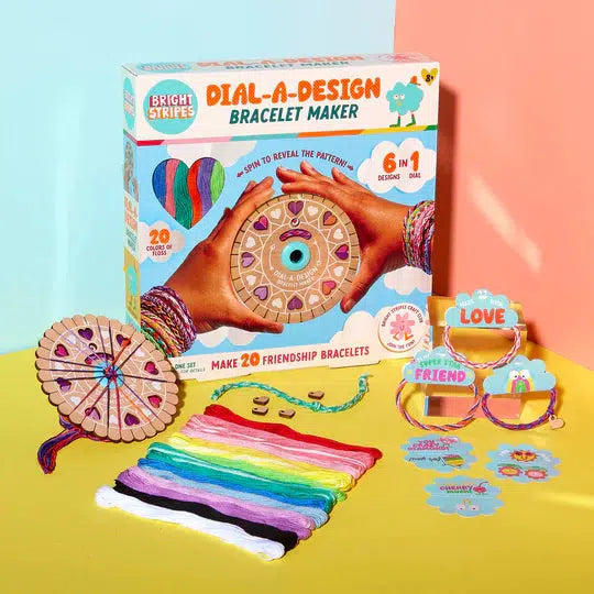 Dial-A-Design Bracelet Maker set includes colorful threads, a wooden bracelet maker, design wheel, and completed bracelets. The package showcases six unique bracelet designs using embroidery floss, perfect for personalizing gift tags or creating heartfelt gifts.