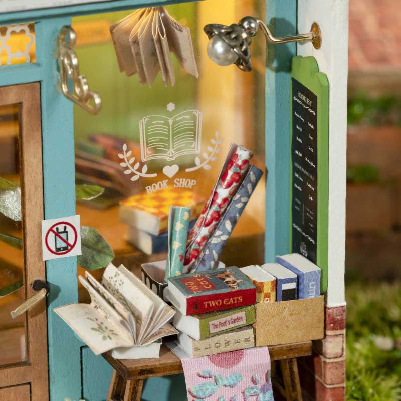 Closeup of the window of the store with a display of books and paper