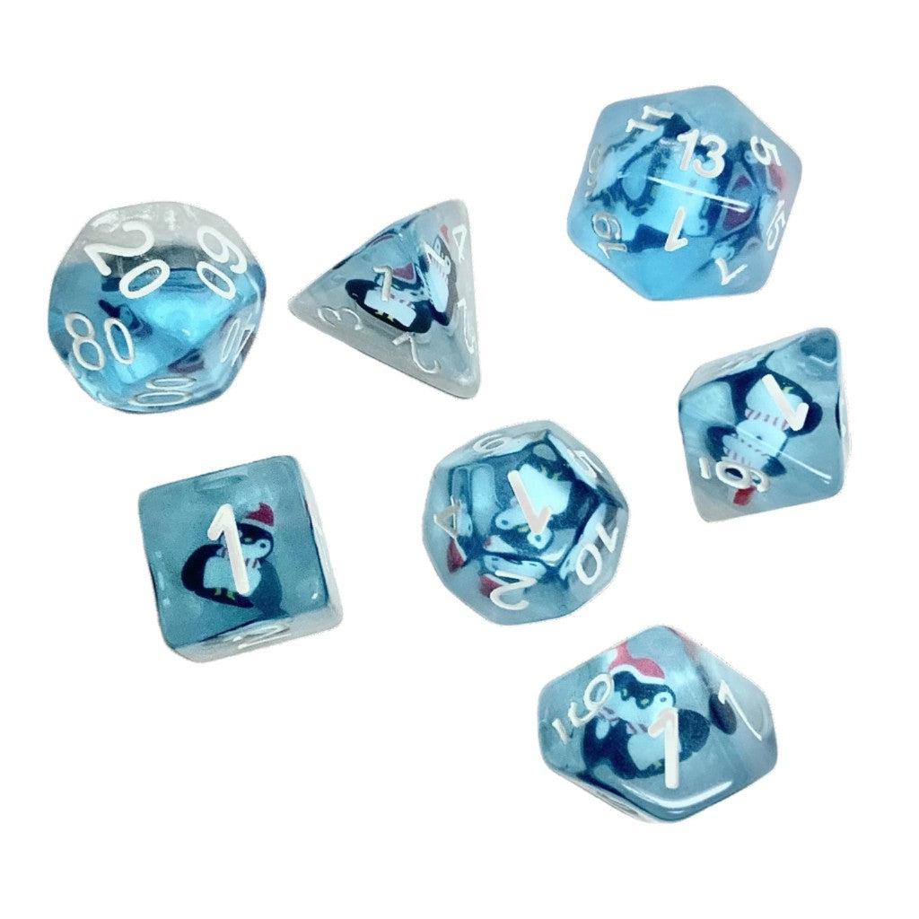 A cluster of blue translucent polyhedral dice, perfect for Pathfinder or Dungeons and Dragons, features intricate penguin designs within.