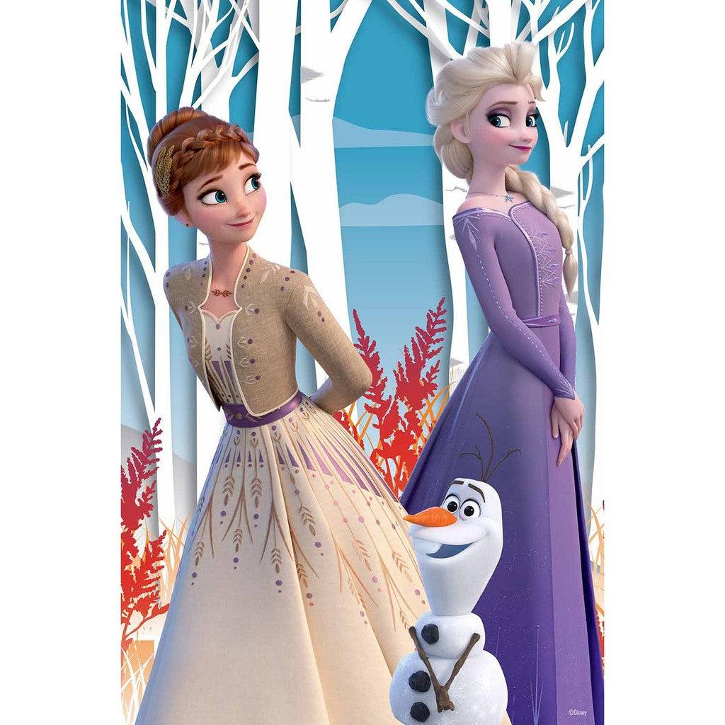 Anna and Elsa stand in front of a winter backdrop with white trees and red foliage, embodying the enchanting world of Frozen Disney. In the foreground, Olaf the snowman adds his usual charm.