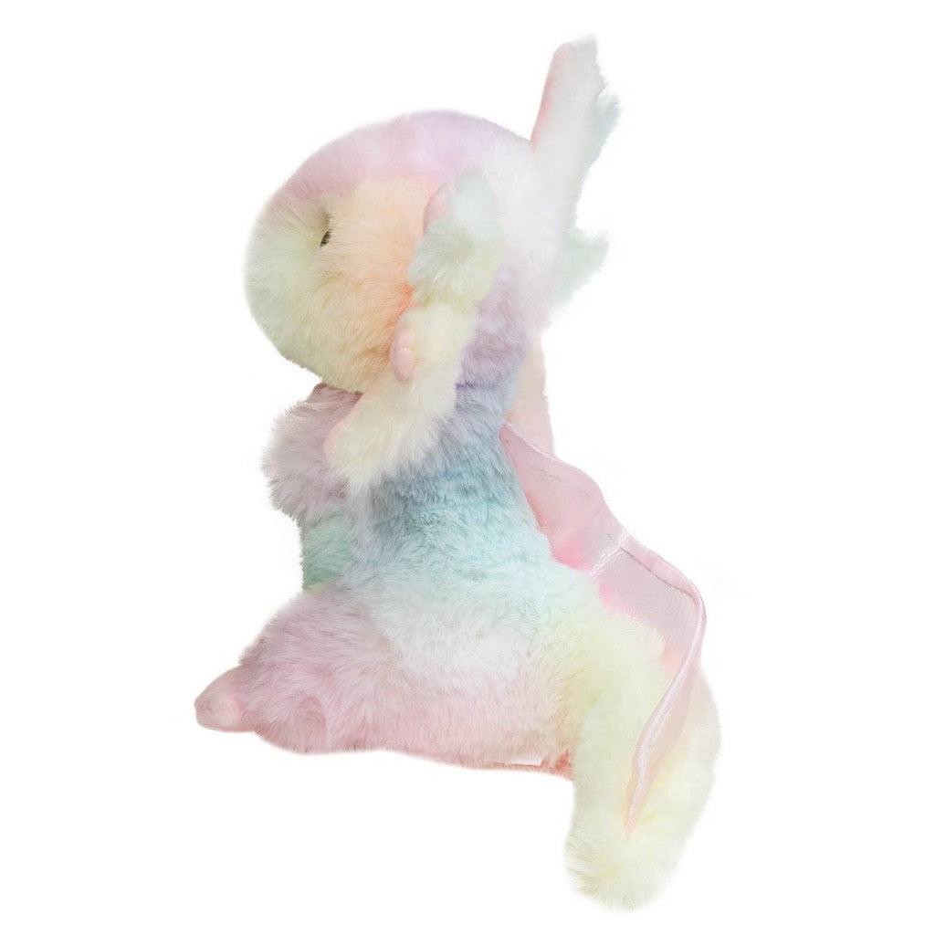 Side view of a plush friend unicorn, adorned in pastel colors with a fuzzy texture and pink wings.