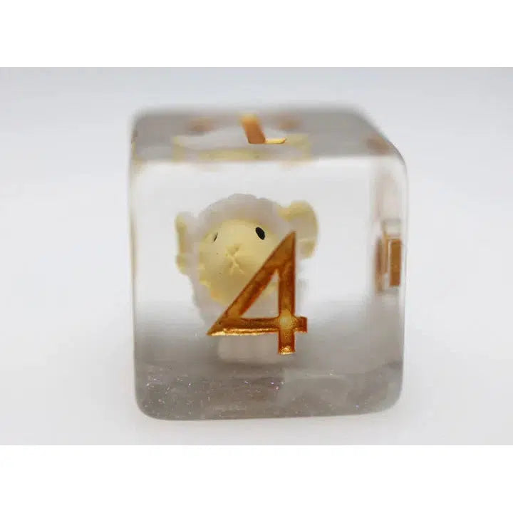 A clear cube with a small toy sheep inside, adorned with a gold number four on the outside, reminiscent of whimsical polyhedral dice used in Dungeons and Dragons.