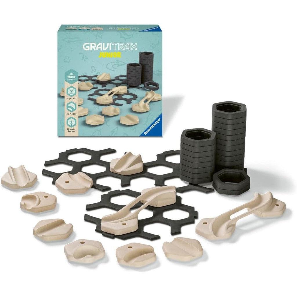 Explore the GraviTrax Expansion kit, perfect for enhancing your marble run with hexagonal tiles and track pieces. Available now at the Ravensburger Online Store, it's a must-have addition to any GraviTrax Junior collection. The kit even comes with a handy storage box in the background.