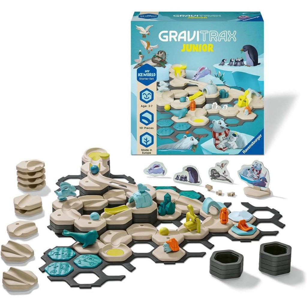 The Ravensburger GraviTrax Junior My Ice World Starter Set is a captivating STEM toy, featuring a Marble Run track with animal figures and various components arranged on a hexagonal base, complete with its packaging box in the background.