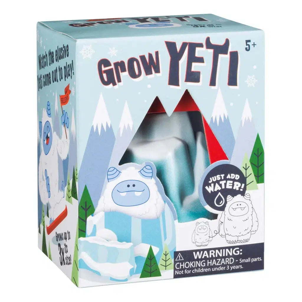 A toy box labeled "Grow Yeti" for ages 5+, featuring charming illustrations of cartoon yetis and snowy mountains—perfect for the winter holidays. The packaging includes a warning about small parts.