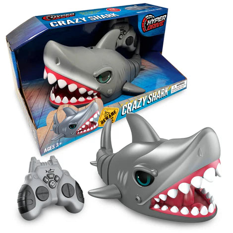 The "Crazy Shark" toy packaging features a shark-shaped toy and controller, perfect for shark lovers. Showcasing realistic movement, this remote control shark comes in a box displaying the "Hyper Toys" logo and an age recommendation of 3+.