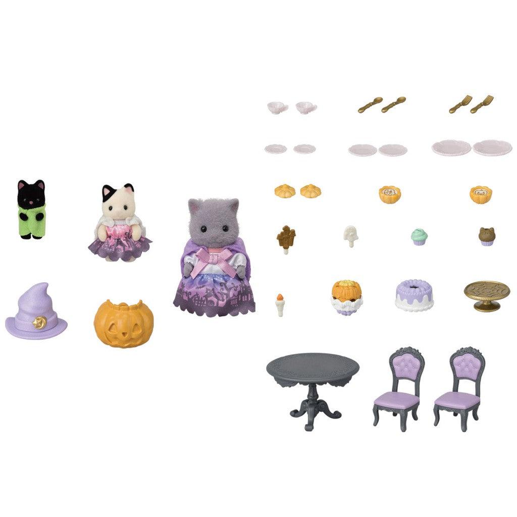 Everything included in Halloween Calico Critter set including three cats, some accessories, and dessert supplies