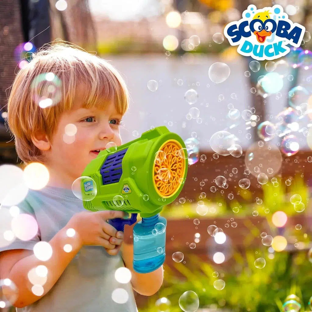 child holding bubble gun, surrounded by gun