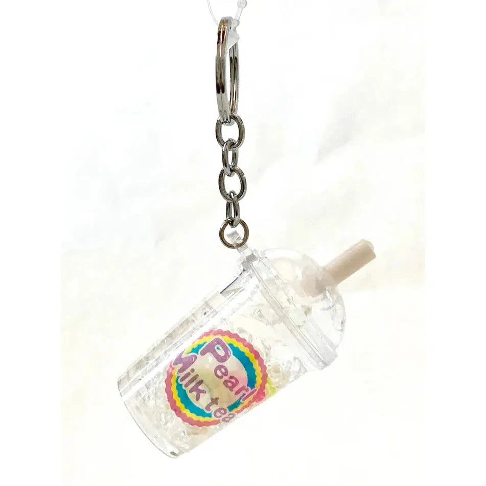 This keychain features a miniature transparent cup with a colorful "Pearl Milk Tea" label, straw, and lid. It’s the perfect key charm for adding a touch of whimsy to your keys. Discover assorted designs that include fruit pearl milk tea variations for an extra splash of fun.