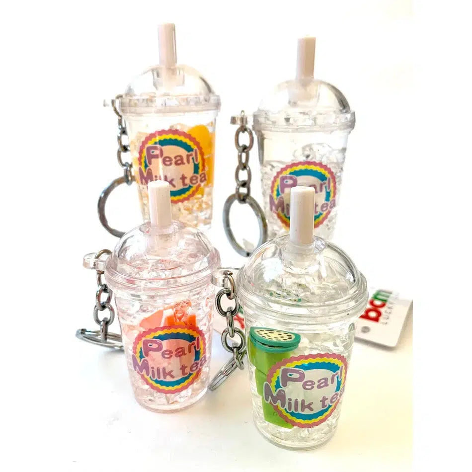 Four keychains shaped like bubble tea cups with clear lids and straws, labeled "Pearl Milk Tea," make a charming addition to your collection. Each key charm adds a playful touch, turning everyday items into fun accessories. Perfect for fans of whimsical designs or simply enjoying some lighthearted flair!