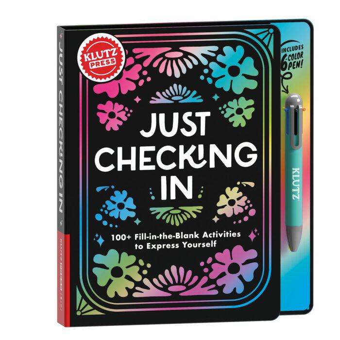 Klutz "just checking in" fill in the blank expression journal. a mostly black cover with rainbow designs, and comes with a 6-color pen