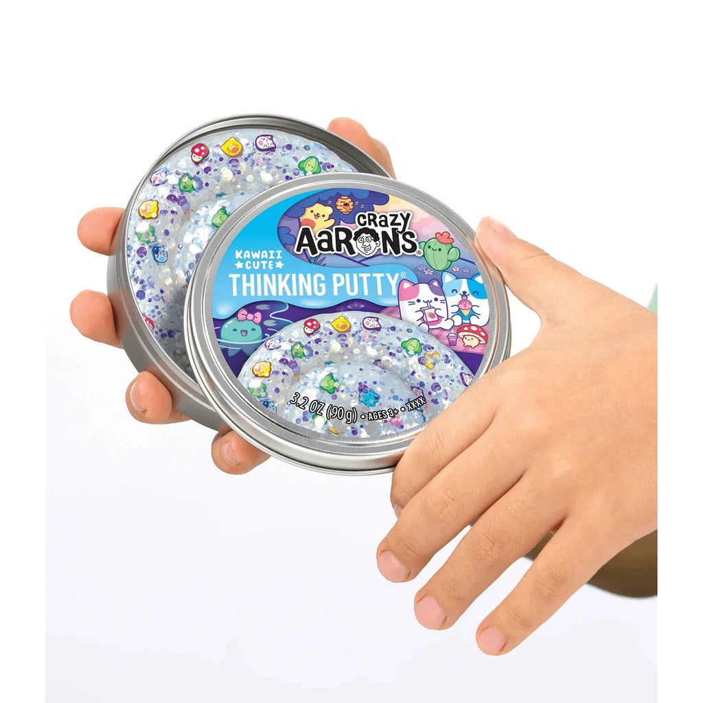 hands holding a tin of kawaii putty