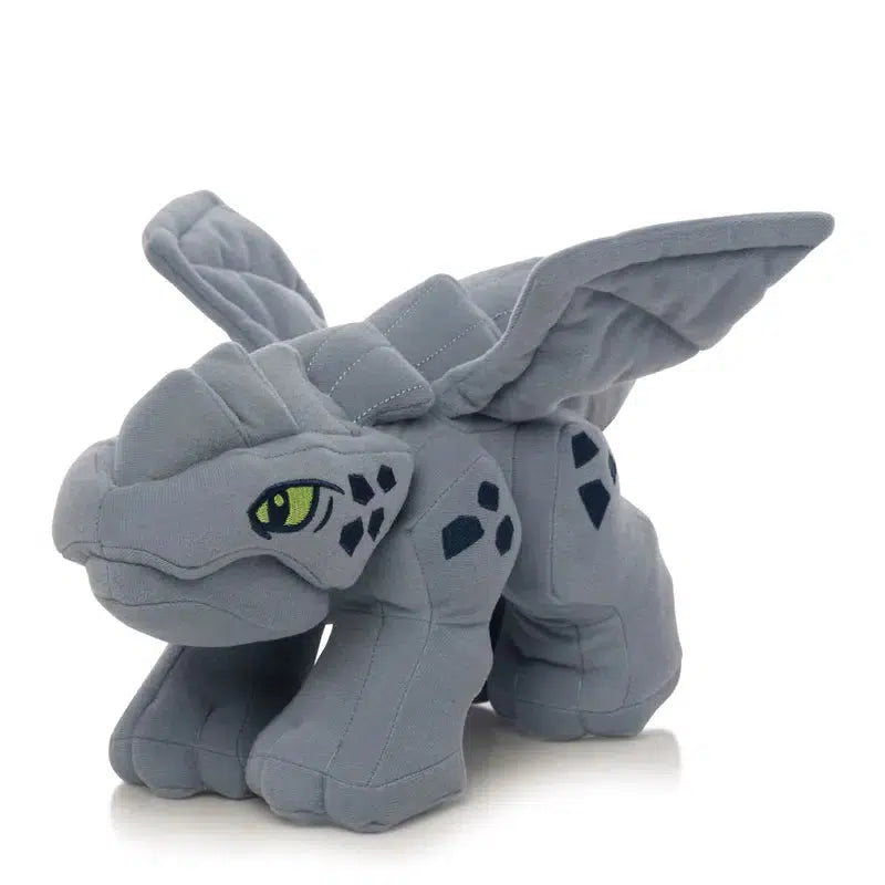 Meet the Baby Dragon, a cuddly gray plush toy with large wings and enchanting green eyes. Its body is adorned with playful black spots, making it perfect for little adventurers inspired by LEGO NINJAGO tales.