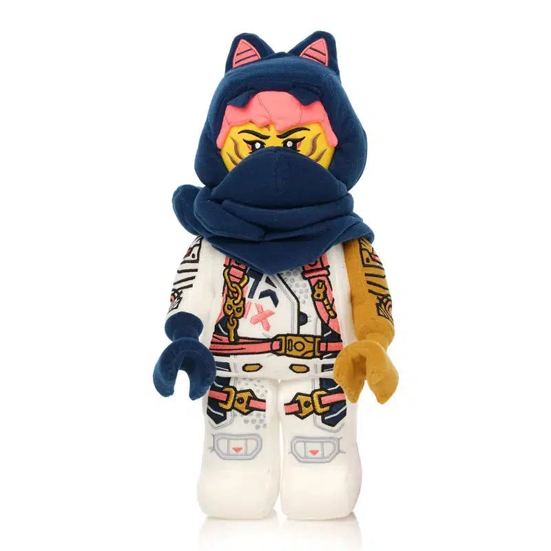 A stylized plush toy figure with a blue hood and scarf, cat ears, and a detailed costume captures the playful essence of NINJAGO adventures.