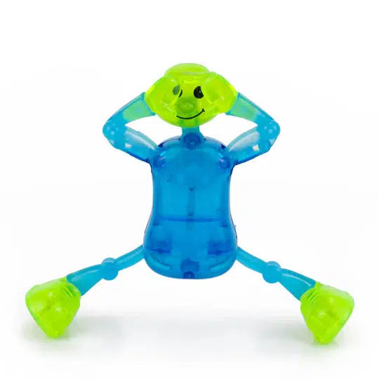 The transparent toy figure, offering endless entertainment, sits with legs apart and hands on its head, showcasing a dynamic blue body and vibrant green limbs.