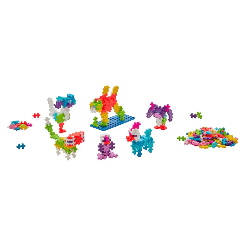 Colorful, interlocking Plus-Plus Pets building blocks are assembled into various furry friends shapes, with endless creativity and extra loose pieces on the right.