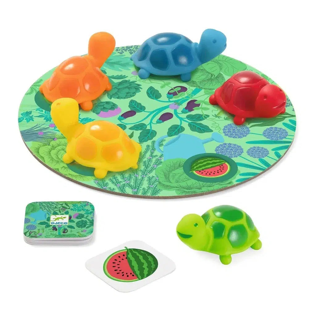 A delightful children's board game that combines visual memory and observation, featuring colorful turtle figures on a green circular board with leaf patterns and cards depicting a watermelon slice.