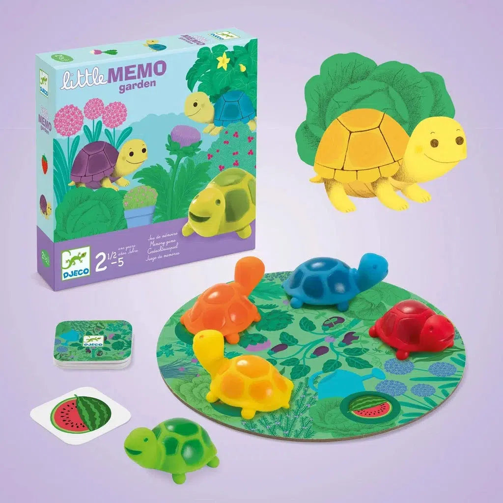 Children's memory game set with a garden theme, featuring colorful turtle figures, a green leaf-covered board, and packaging labeled "Little Memo Garden.