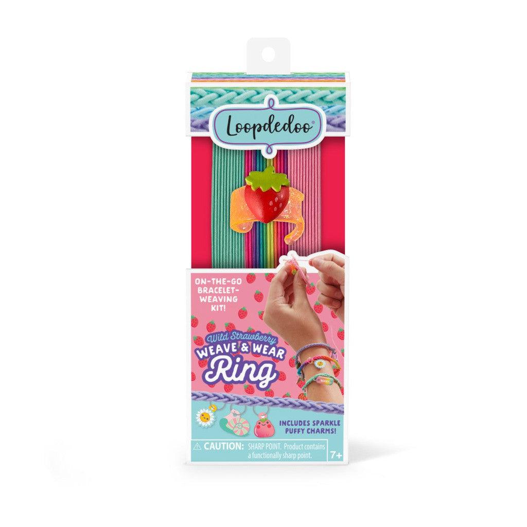 Bracelet weaving kit with five colorful threads and a strawberry charm, labeled "Wild Strawberry Weave &amp; Wear Ring." Suitable for ages 7 and up.