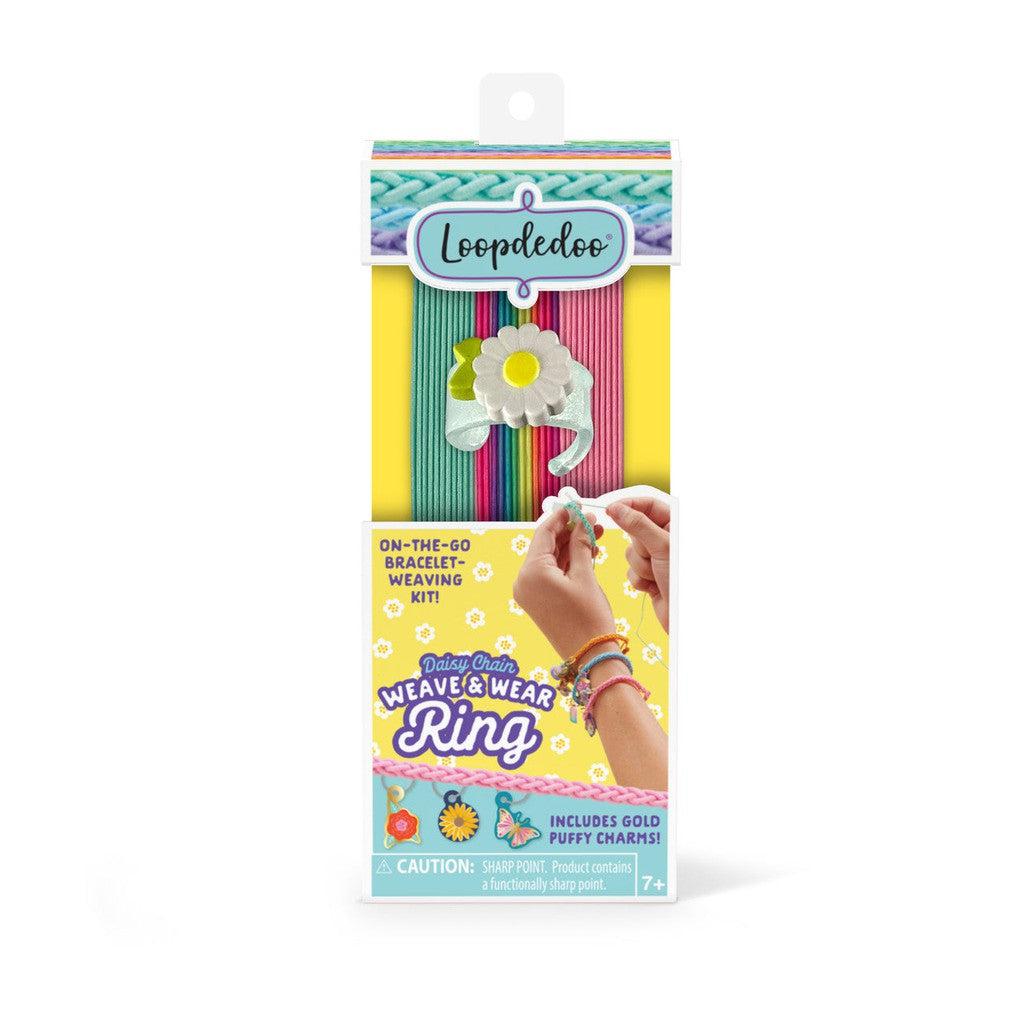 Brightly colored Loopdedoo bracelet weaving kit box with a flower ring design on the front, showcasing yarn spools and bracelet-making instructions. Suitable for ages 7 and up.