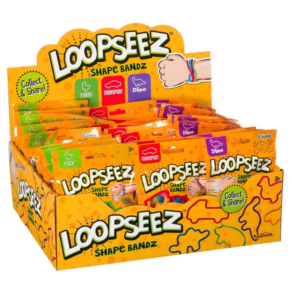 The engaging box display of Loopseez Shape Bandz features vibrant bands in bright packaging, showcasing assorted shapes that make it a must-have collector's item.