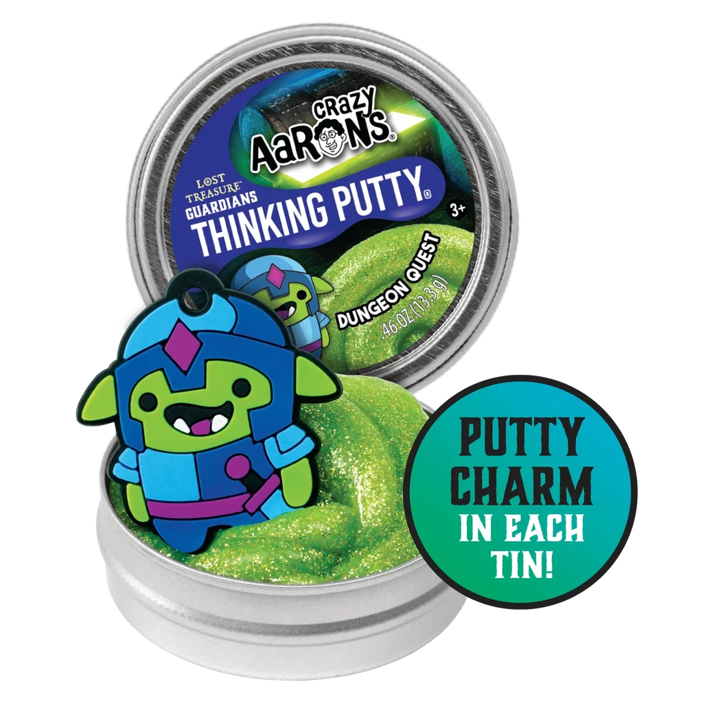 Putty tin open showing the putty inside along with a charm that comes with it