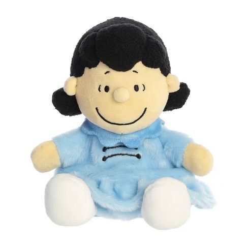 Lucy Palm Pals plush by Aurora. A small round version of Lucy from the Peanuts franchise in her iconic blue dress