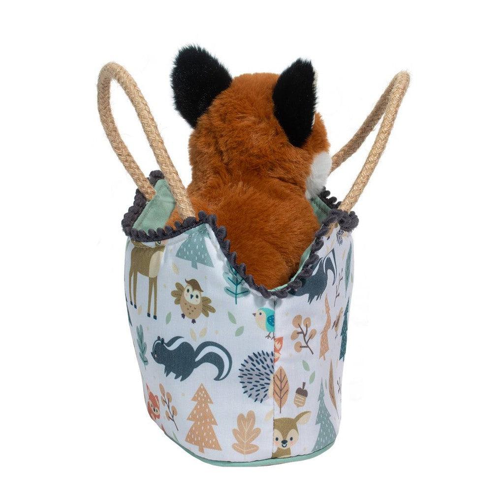 A plush Red Fox nestled in a Magical Forest Sassy Pet Sak, this stuffed animal sits proudly in a patterned fabric basket with rope handles, adorned with enchanting woodland animal designs.